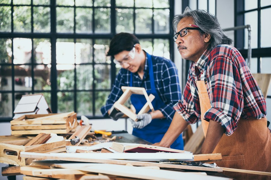 Carpenters working together in a wood shop